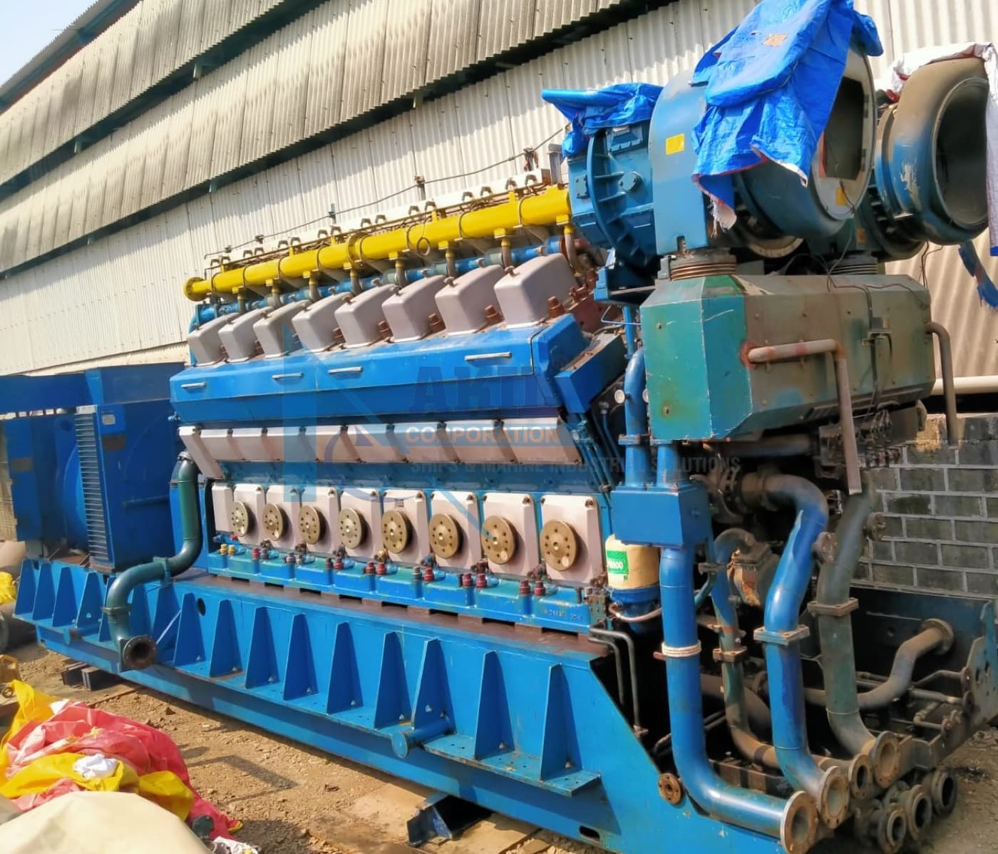 Wärtsilä 16V32D genset under a shed roof, engine and alternator on a common base